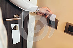 Hand Holding Key card Hotel room access