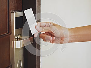 Hand Holding Key card Hotel room access