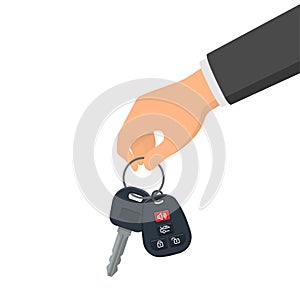 Hand holding a key and a fob. Concept of buying or renting a new car