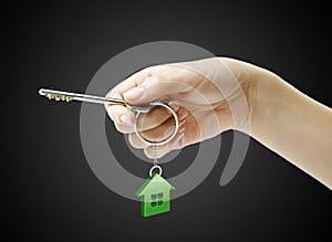 Hand holding key with a keychain