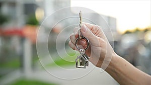 Hand Holding Key From A New House.