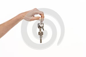 Hand holding keys isolated on white background
