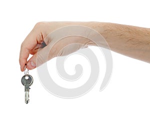 Hand holding keys isolated on a white background