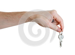 Hand holding keys on a white