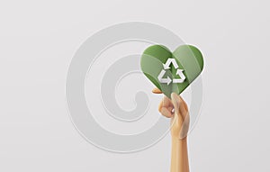 Hand holding leaves heart shape on white background