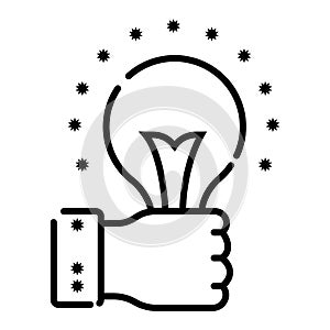 Hand holding a light bulb