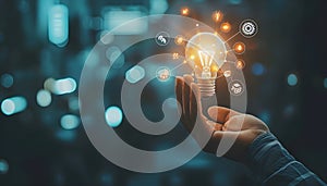 Hand holding light bulb and business digital marketing innovation technology