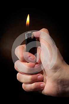 Hand holding lighter