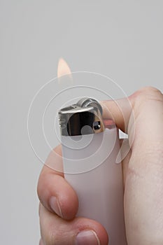 Hand holding a lighter