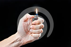 Hand Holding Lit Lighter