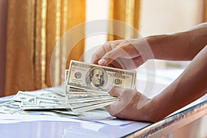 Hand holding loan money dollar bank note give financial payment. Man hands showing spread 100 dollar exchange cash payout. Saving
