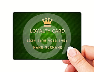 Hand holding loyalty card isolated over white