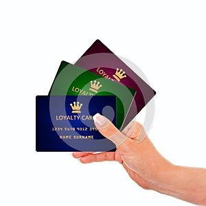 Hand holding loyalty cards isolated over white