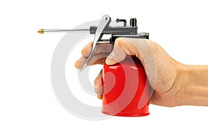 Hand holding the machine oil spray bottle gun