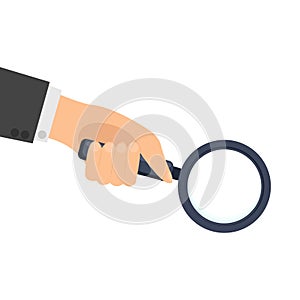 Hand holding a magnifying