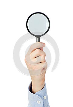 Hand holding magnifying glass