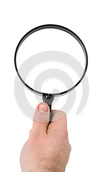 Hand holding magnifying glass