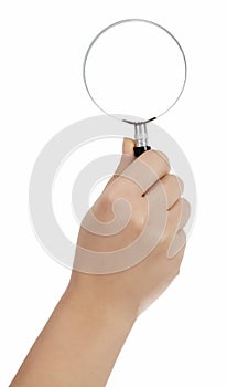 Hand holding magnifying glass