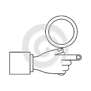 Hand holding magnifying glass in black and white