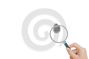 Hand holding magnifying glass and finding at fingerprint.