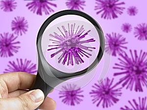Hand holding magnifying glass focusing on virus bacterium cell