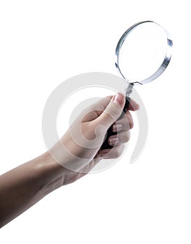 Hand holding magnifying glass isolated on white background