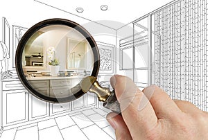 Hand Holding Magnifying Glass Revealing Custom Bathroom Design Drawing and Photo Combination photo