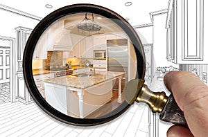 Hand Holding Magnifying Glass Revealing Finished Kitchen Build Over Drawing