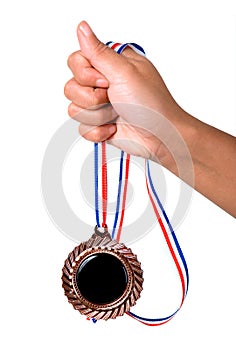 Hand holding a medal