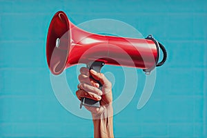 Hand holding megaphone Announcement concept promotion and advertising concept