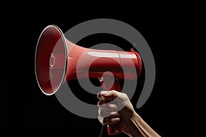 Hand holding megaphone Announcement concept promotion and advertising concept