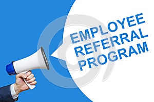 A hand is holding a megaphone with speech bubble Employee Referral Program. Announcement and advertising