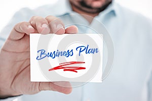 Hand holding message card - Business Plan