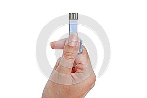 Hand holding Metal Key USB data storage isolated on white background
