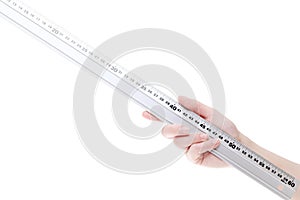 Hand holding metal ruler