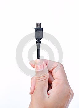 Hand holding micro usb cable on white background