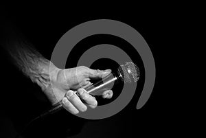 Hand holding microphone