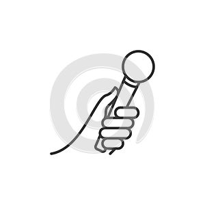 Hand holding microphone vector icon in thin line style