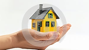 The hand holding miniature house.AI generated image