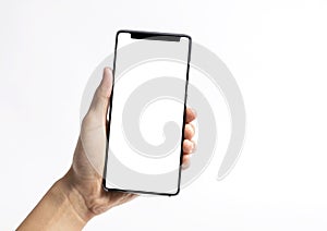 Hand holding mobile phone and blank screen for mockup template advertising and branding technology background