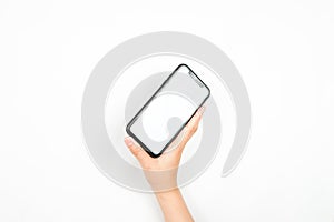 Hand holding a mobile phone with a blank white screen for mockup