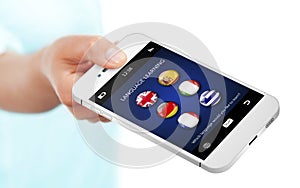 hand holding mobile phone with language learning application over white photo