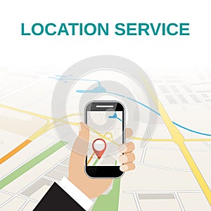 Hand holding mobile phone with navigation application