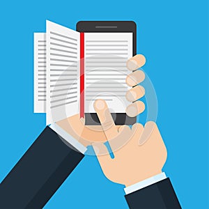 Hand holding a mobile phone with an open book on screen