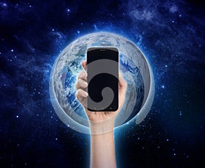 hand holding mobile phone or smart phone on Planet Earth background. Life