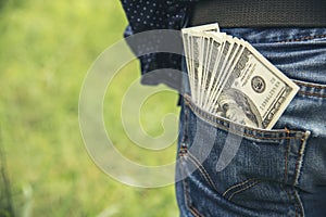 Hand holding money dollar bank note in wallet give financial payment. Man hands showing spread 100 dollar exchange cash payout.