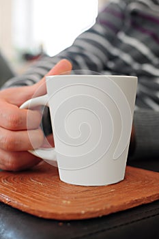 Hand holding mug
