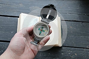 Hand Holding Navigational Compass