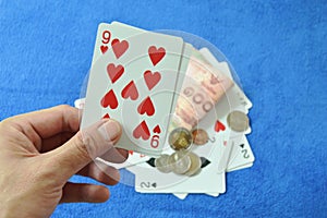 Hand holding nine in baccarat games