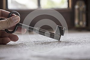 Hand holding an old rustic key